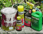 a collection of hazardous household waste in bottles and containers