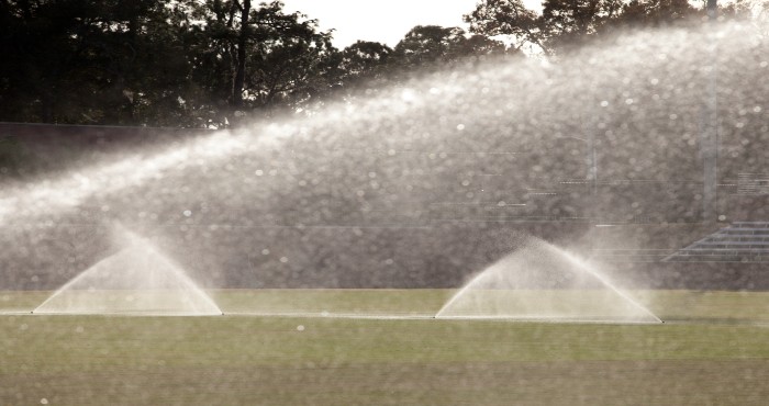 irrigation sprinklers watering lawn