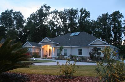 a residential home at night illuminated with energy efficient lighting